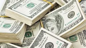 Many  bundle of US 100 dollars bank notes